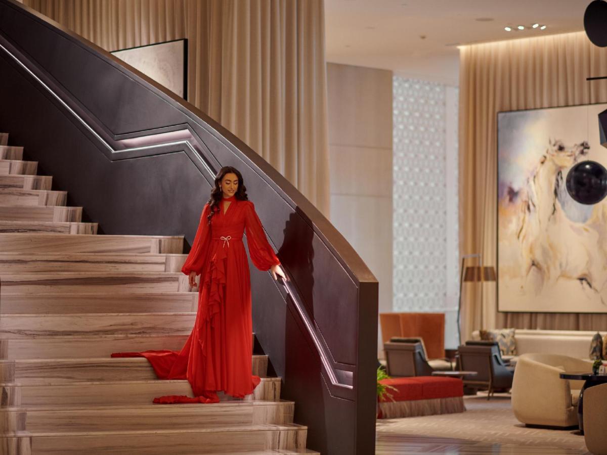 Grand Hyatt Kuwait Hotel Kuwait City ภายนอก รูปภาพ A model in a red dress